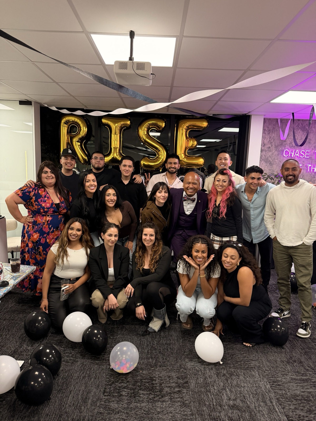 Team members celebrating together at a Rise party