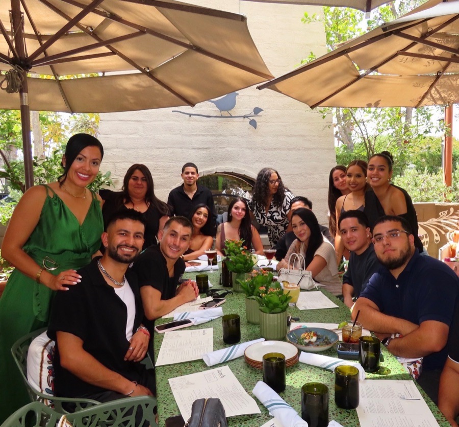 Agents sharing a team lunch around the table